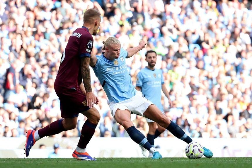 Haaland's hat-trick helps Man City reach the top alongside Brighton