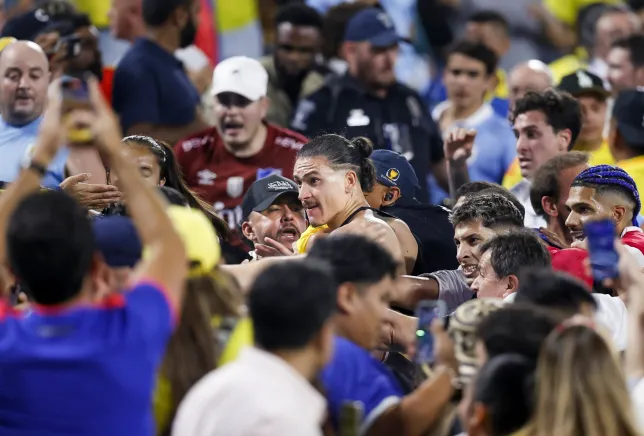 Liverpool player handed five-game suspension and fined Â£15,000 following altercation with fans during Copa America